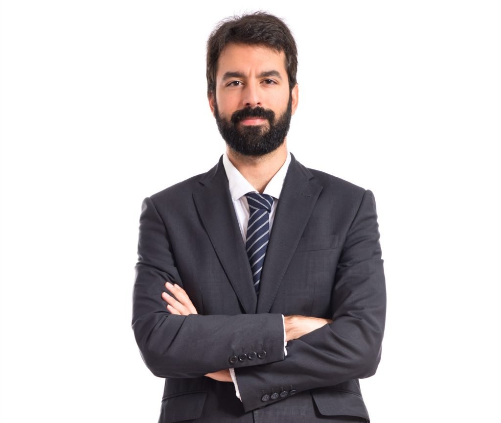 Businessman with his arms crossed over white background